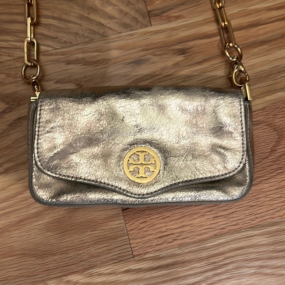 Gold Tory Burch clutch with detachable gold chain strap